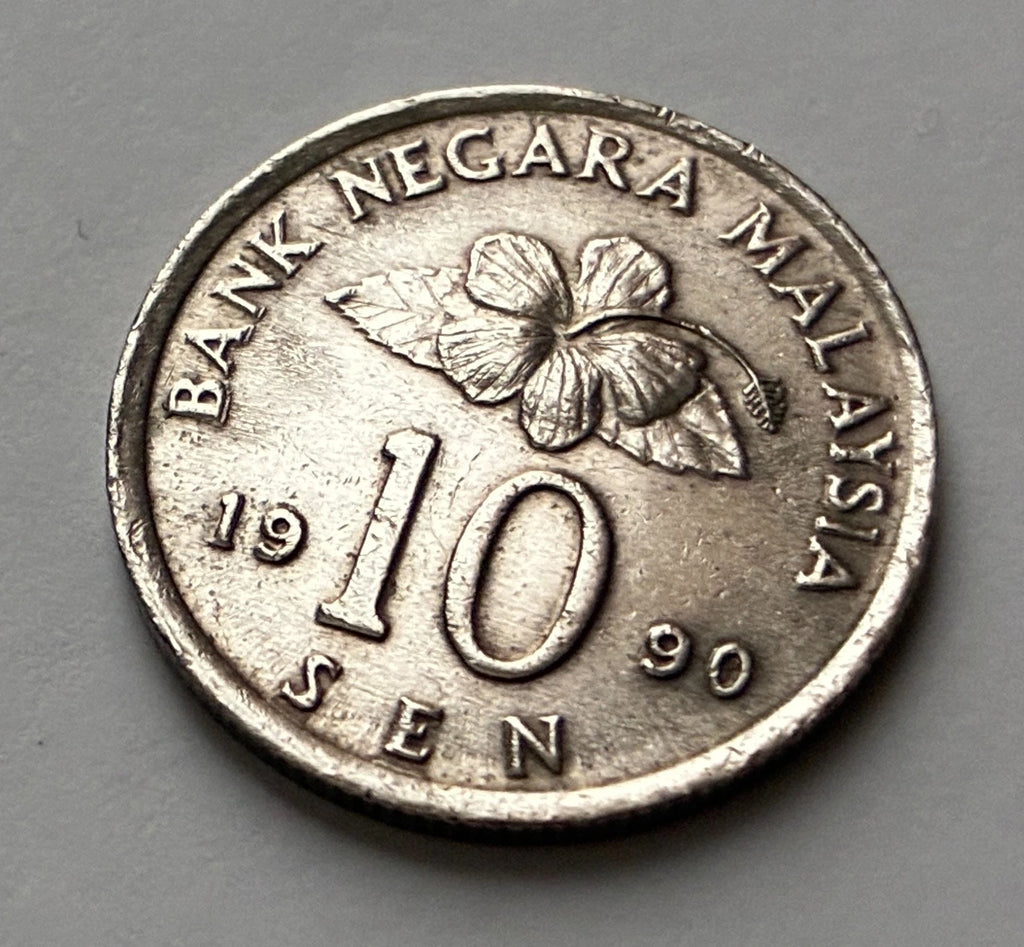 10 Sen 1990 | Malaysia | Congkak-Spiel & Hibiskus | Kupfer-Nickel | Kursmünze