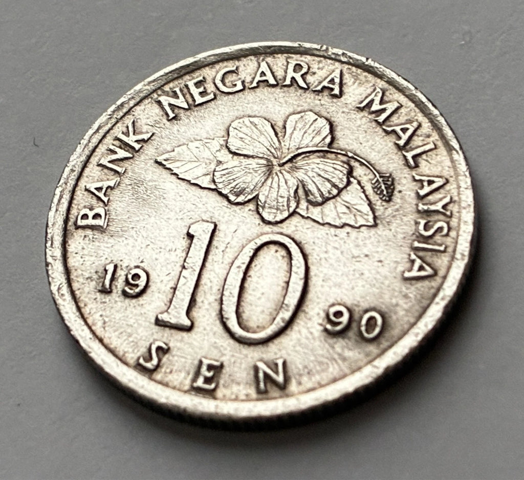 10 Sen 1990 | Malaysia | Congkak-Spiel & Hibiskus | Kupfer-Nickel | Kursmünze