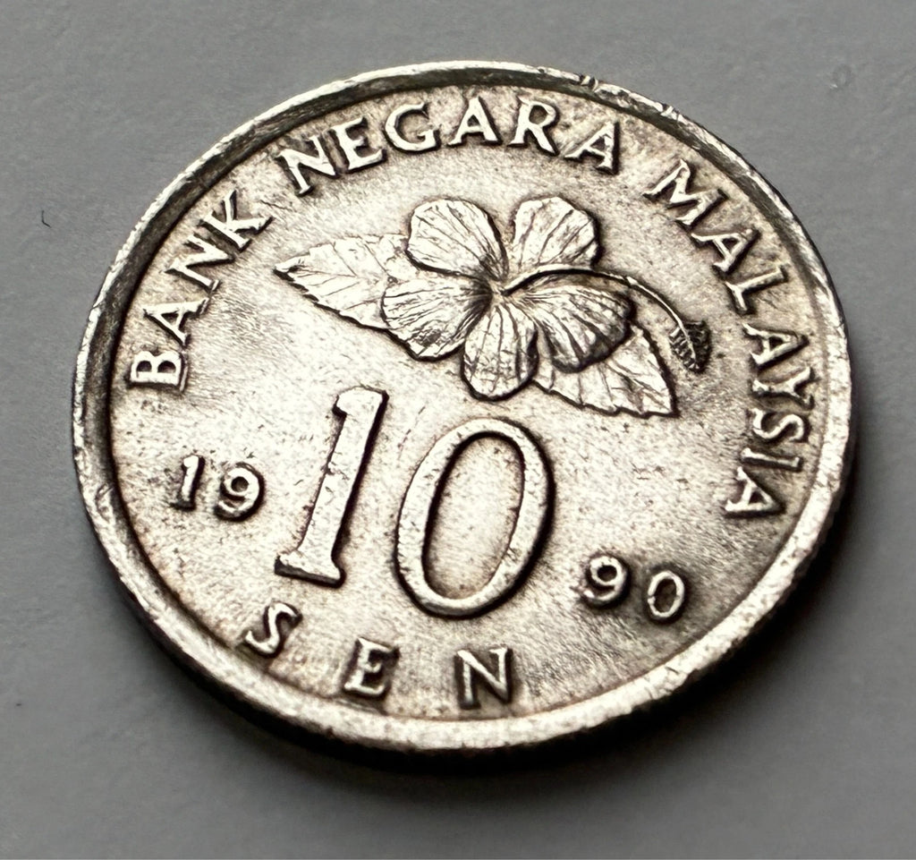 10 Sen 1990 | Malaysia | Congkak-Spiel & Hibiskus | Kupfer-Nickel | Kursmünze