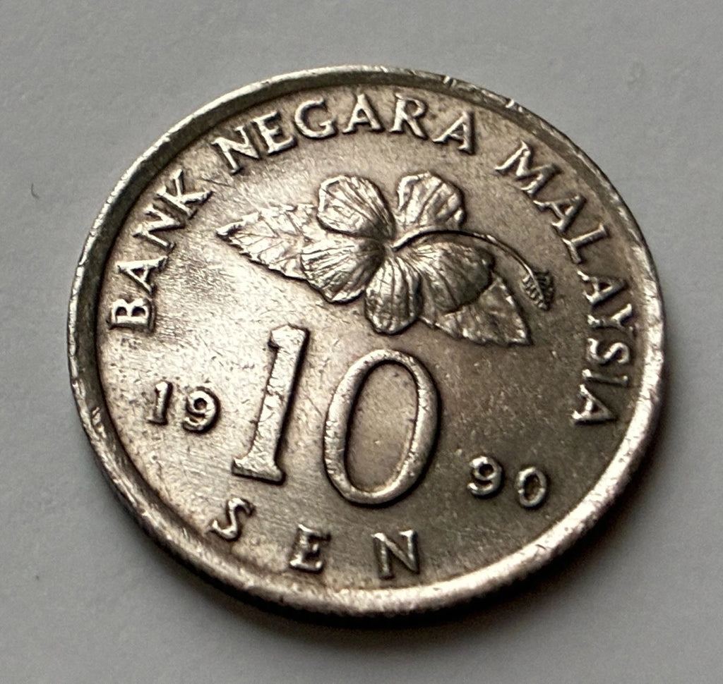 10 Sen 1990 | Malaysia | Congkak-Spiel & Hibiskus | Kupfer-Nickel | Kursmünze
