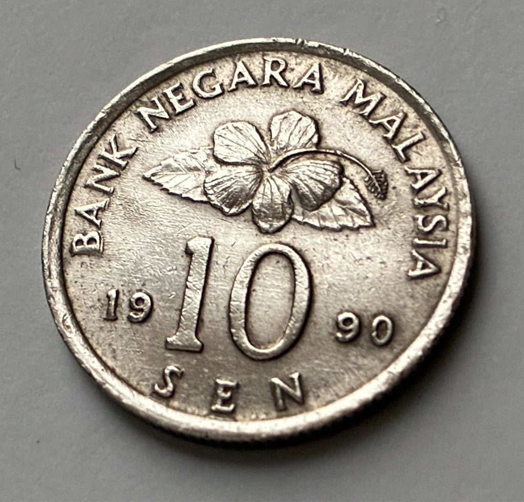 10 Sen 1990 | Malaysia | Congkak-Spiel & Hibiskus | Kupfer-Nickel | Kursmünze